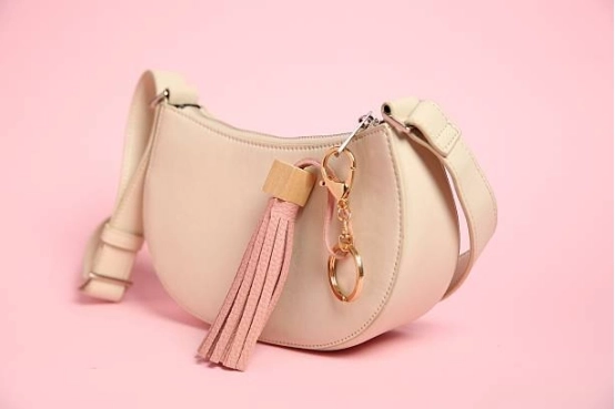 tassel-keychain-attached-to-pink-handbag